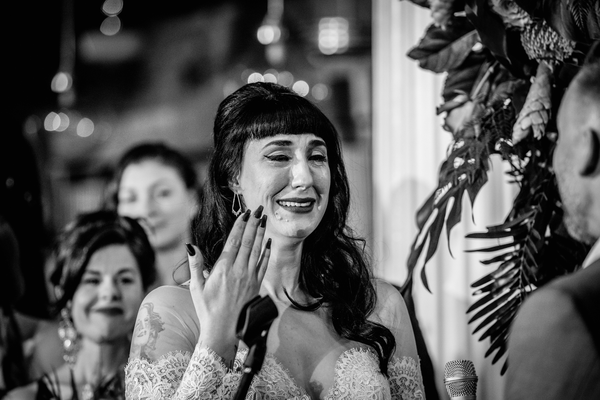 A bride cries while reading her vows at a Salvage One wedding. 