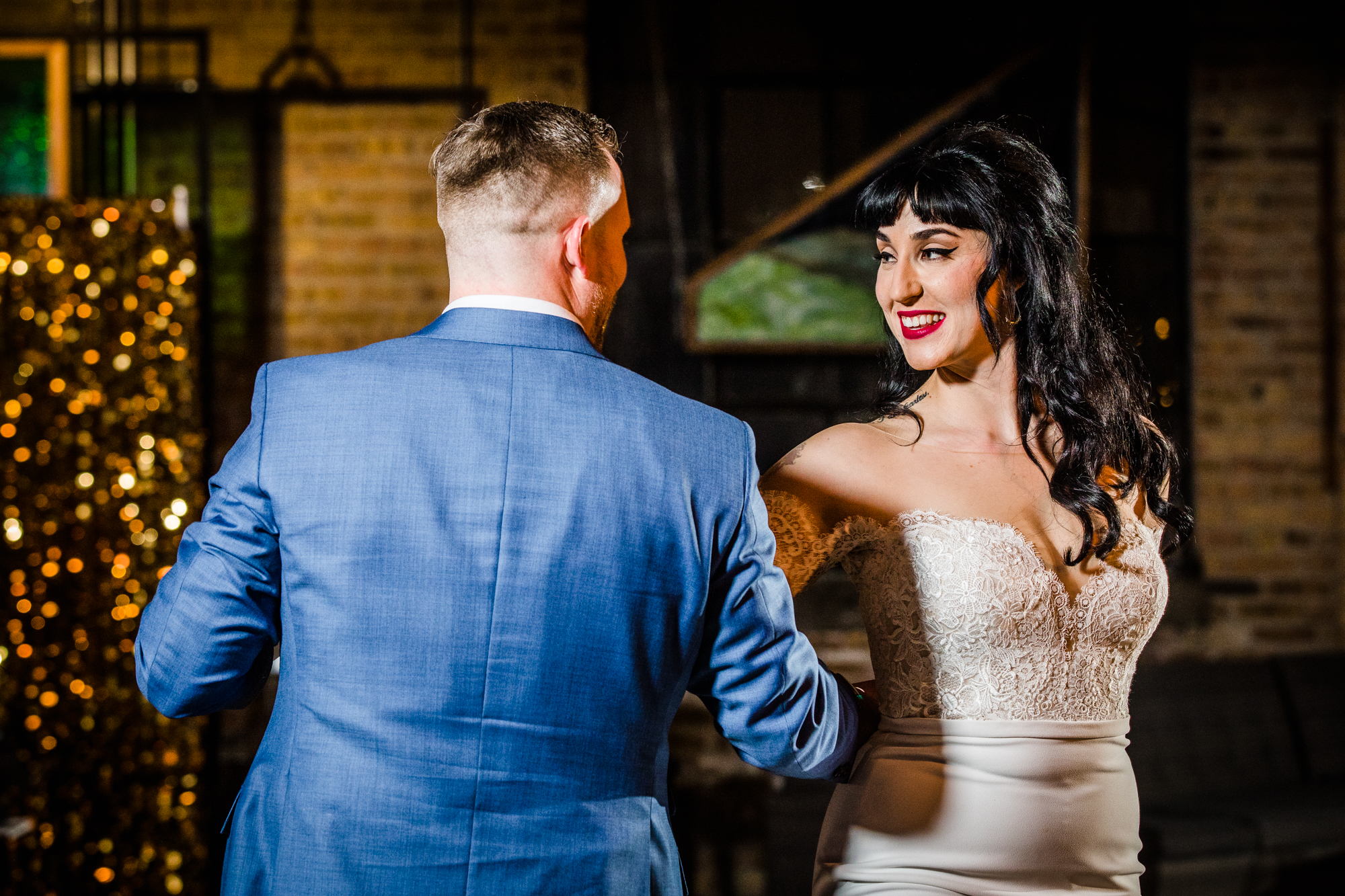 A couple shares their first dance together at a Salvage One wedding reception. 