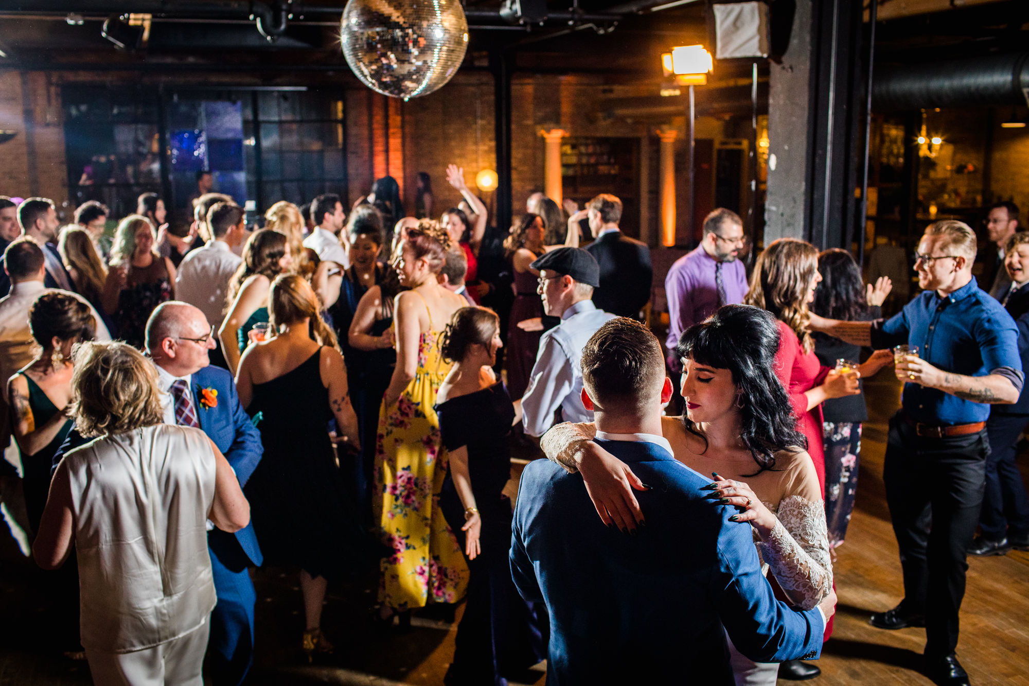 Guests dance at a Salvage One wedding reception. 