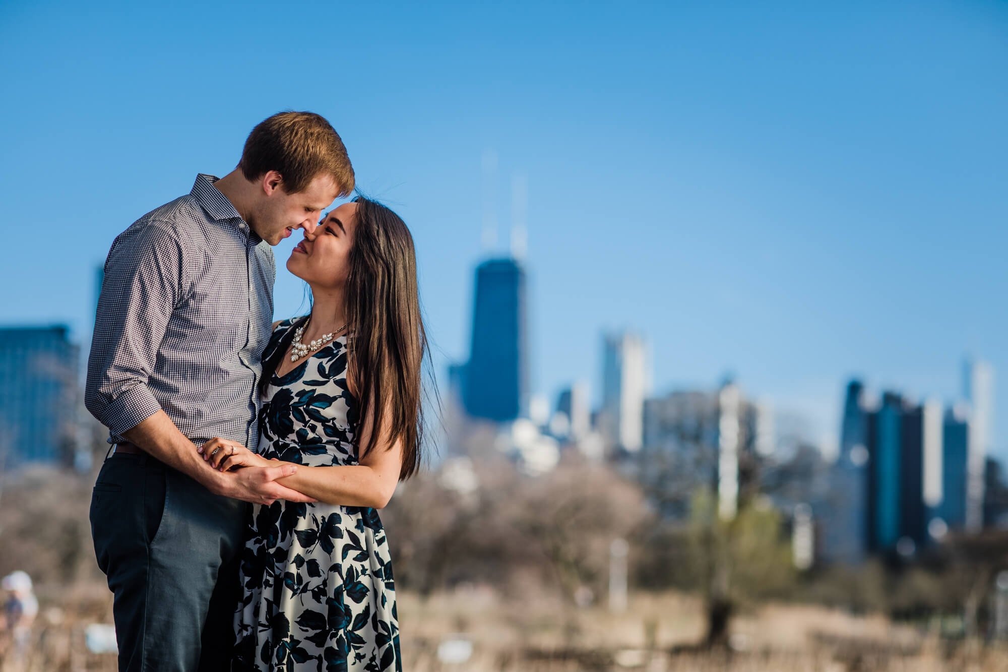 Couple stand close for Chicago engagement photographer in Lincoln Park