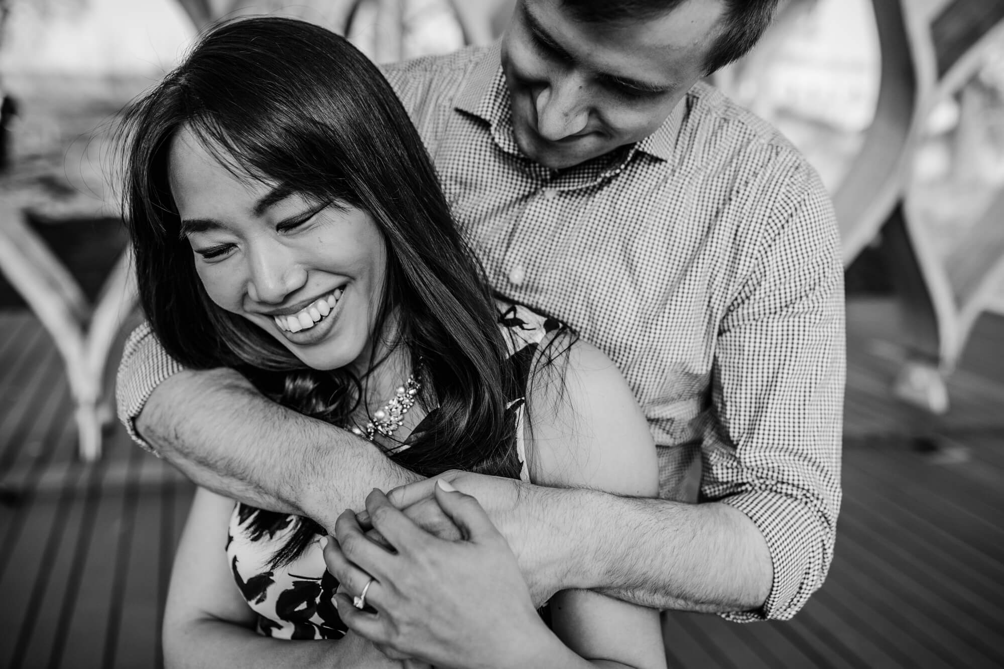 Black and white of couple together at spring engagement shoot by honeycomb in Lincoln Park
