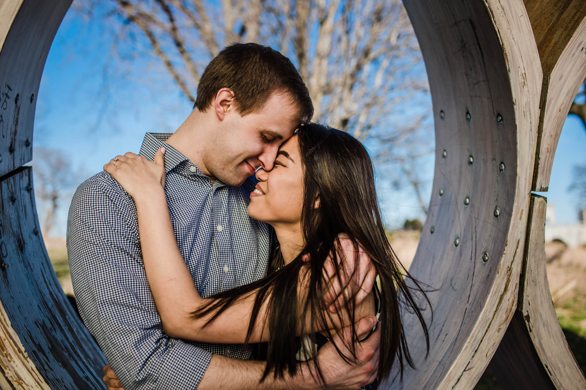 Couple embrace during spring engagement shoot at Lincoln Park, Chicago