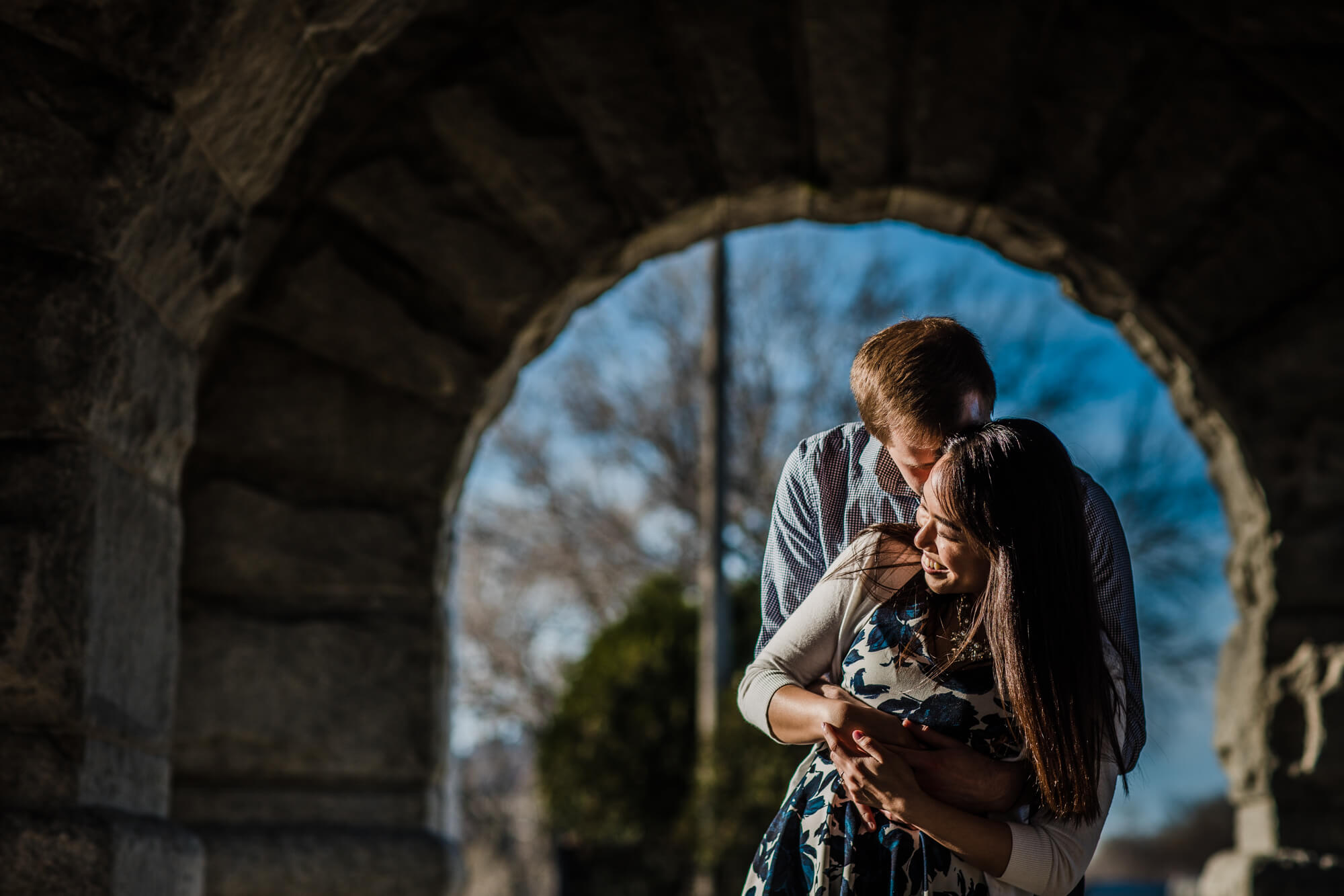 Couple laugh during spring engagement shoot at Lincoln Park, Chicago