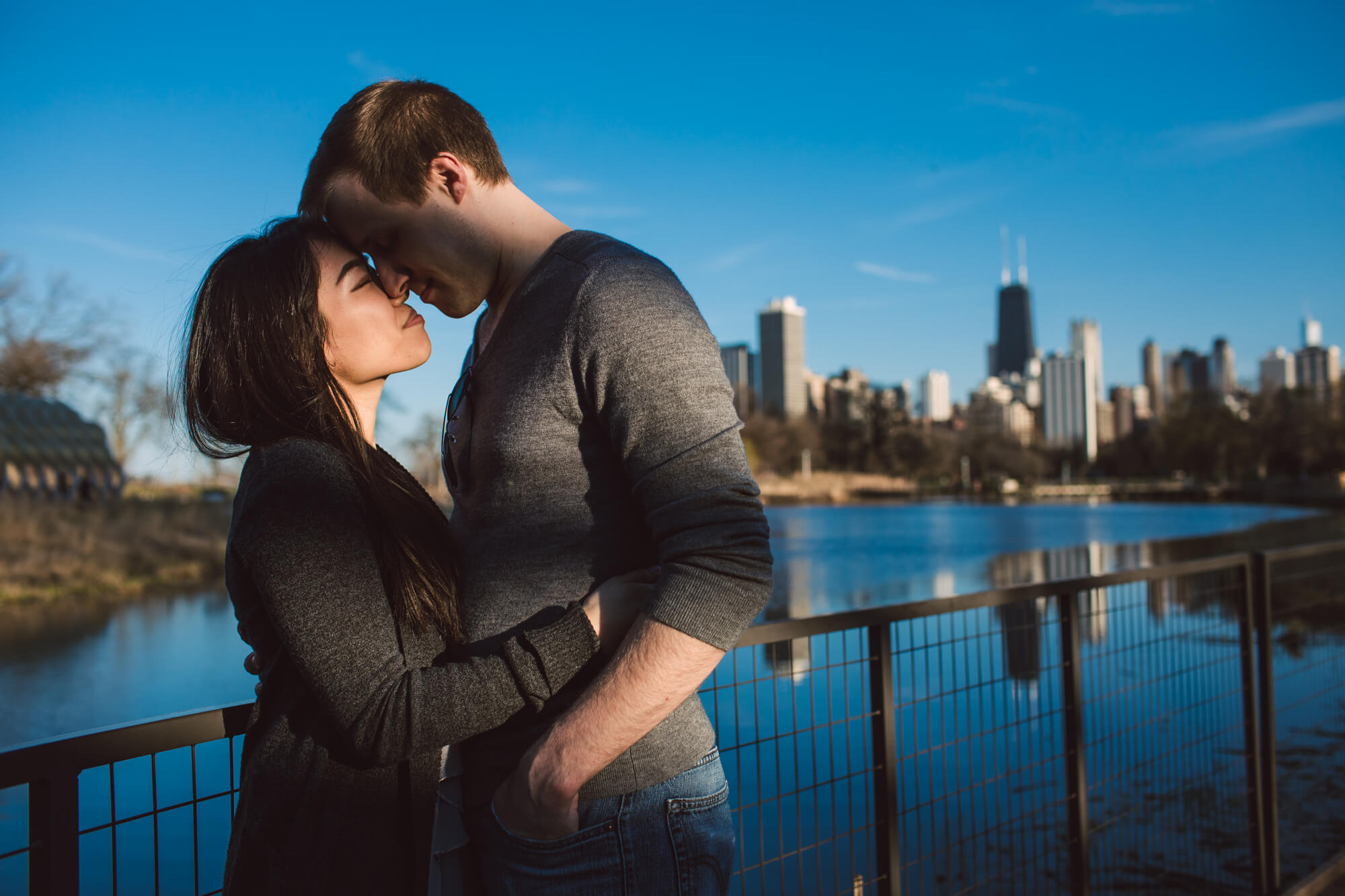 Couple share romantic moment after engagement in Lincoln Park, Chicago
