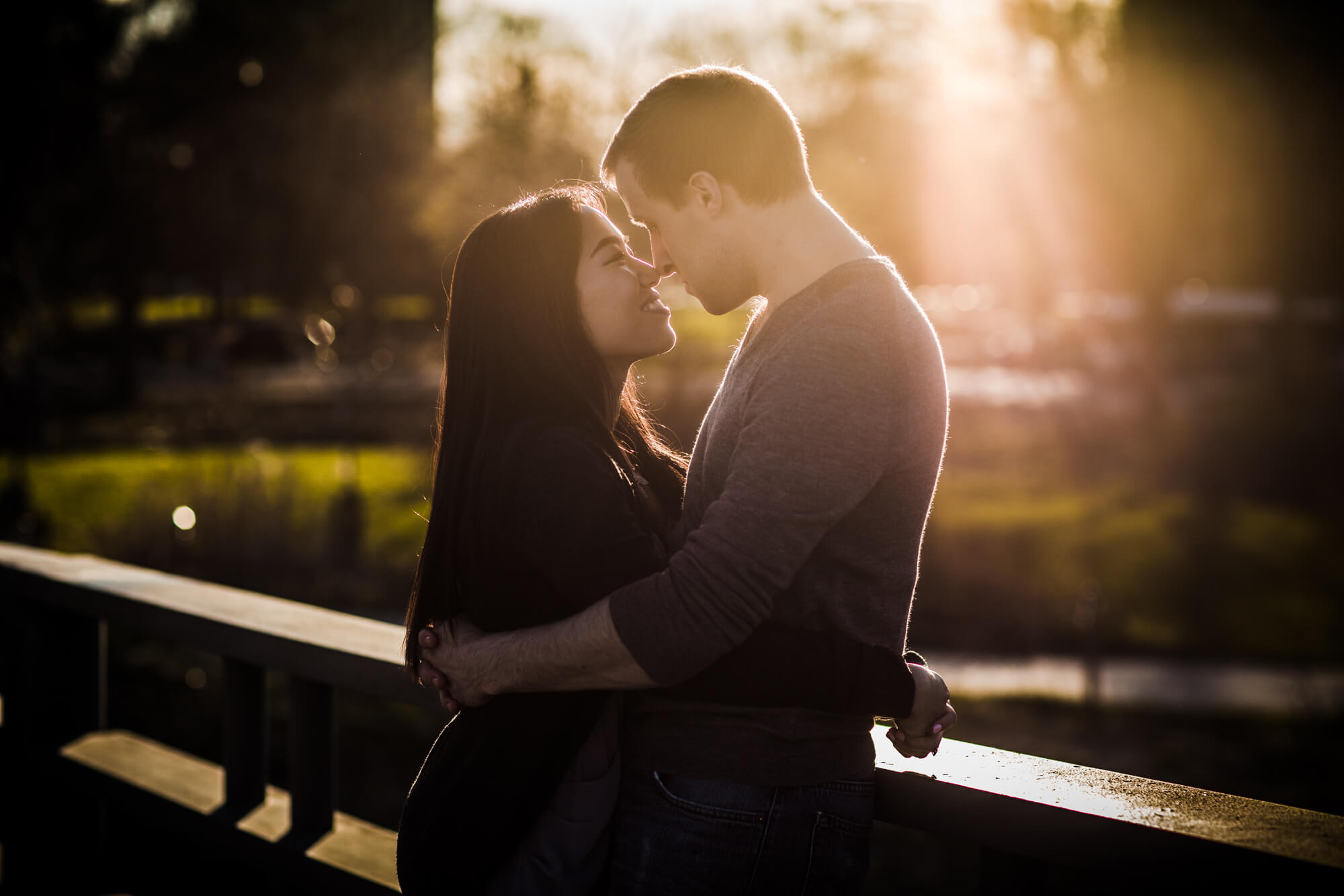 Couple embrace in sunlight for shoot with Chicago engagement photographer
