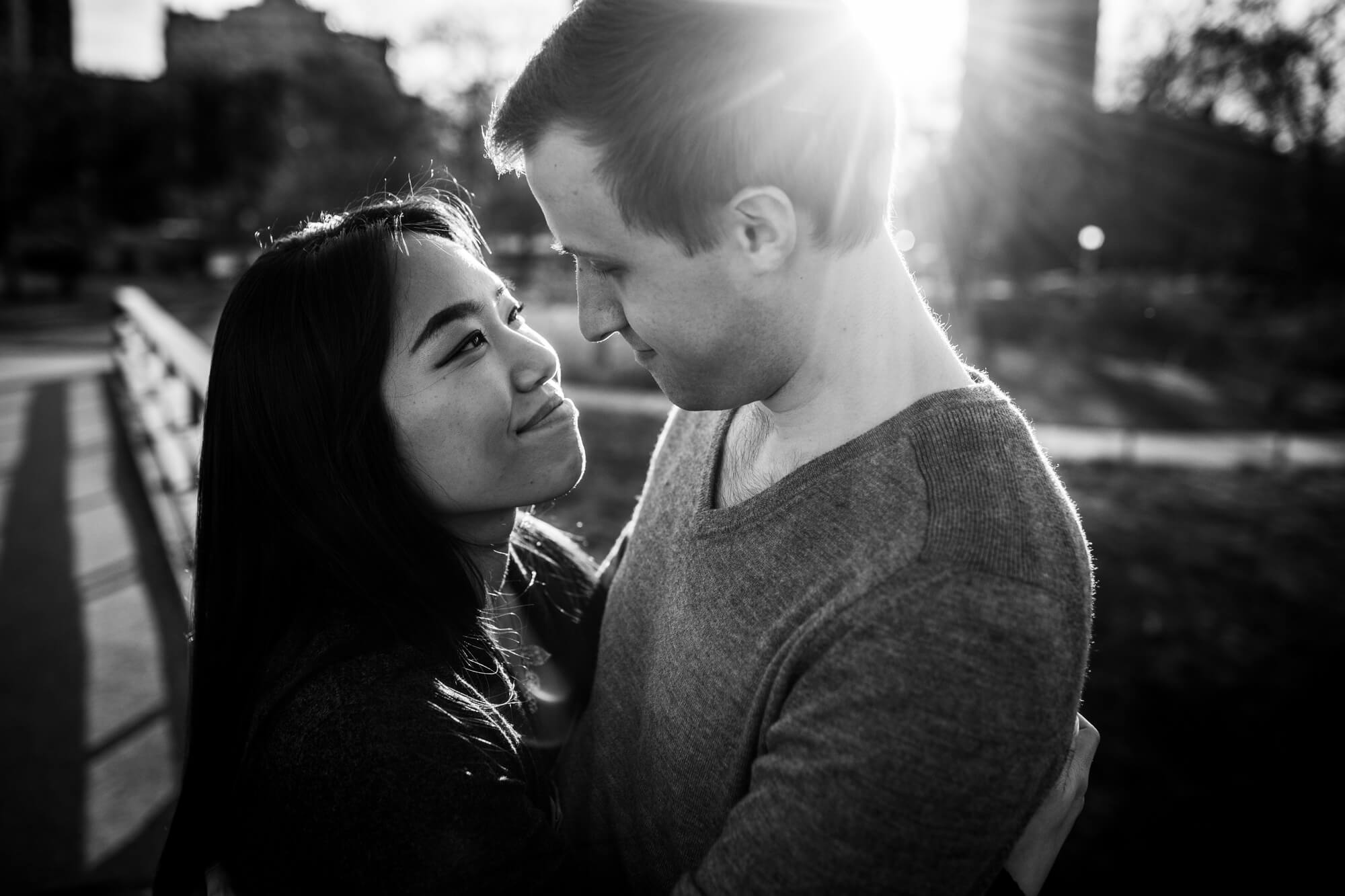 Couple look into each other's eyes during spring engagement shoot in Lincoln Park, Chicago