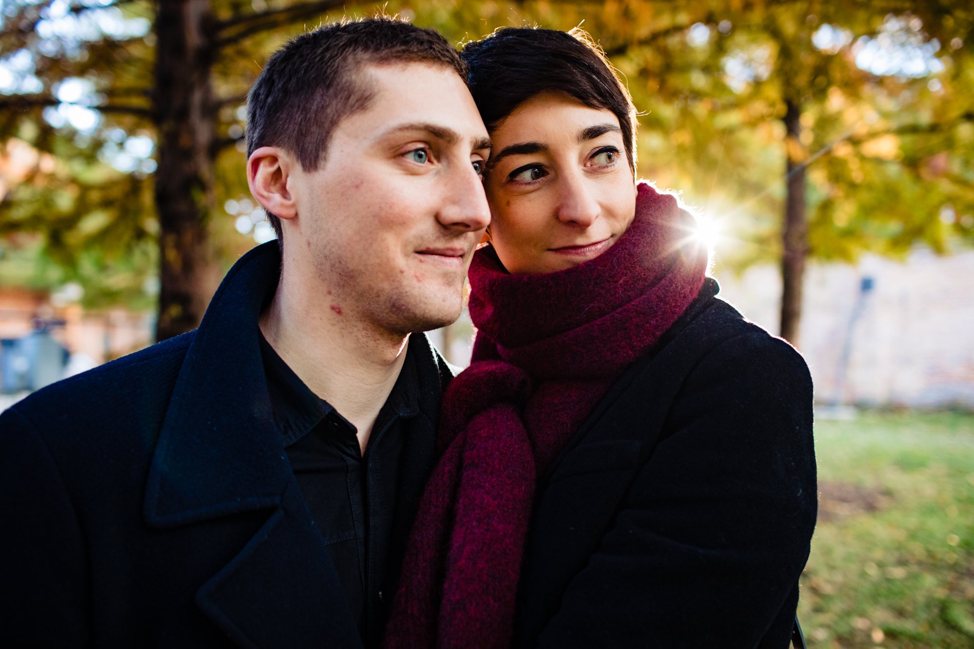 A couple smiles together during a Wicker Park engagement session.
