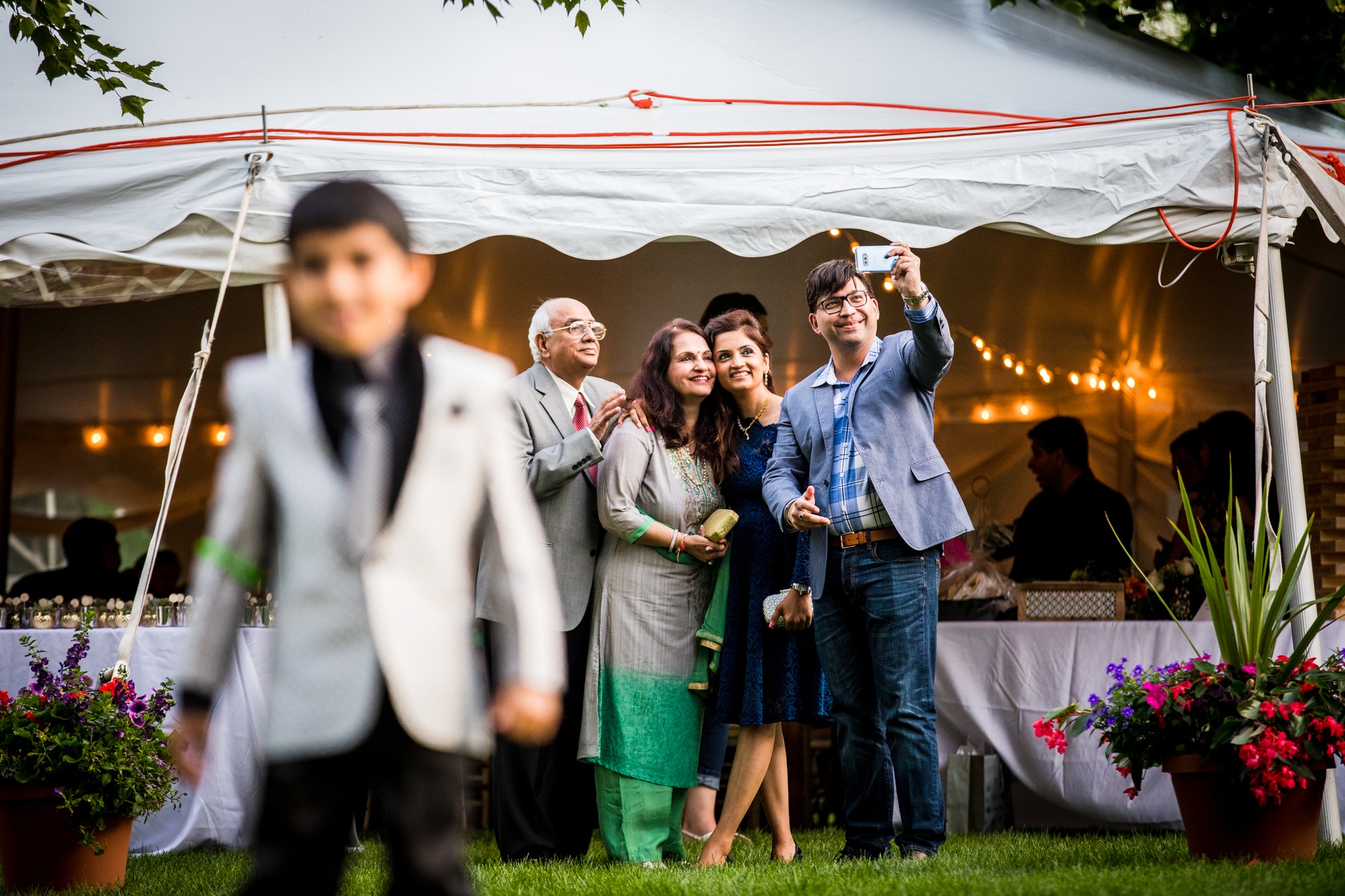 Guests take a photo together at a backyard wedding in Yorkville, Illinois