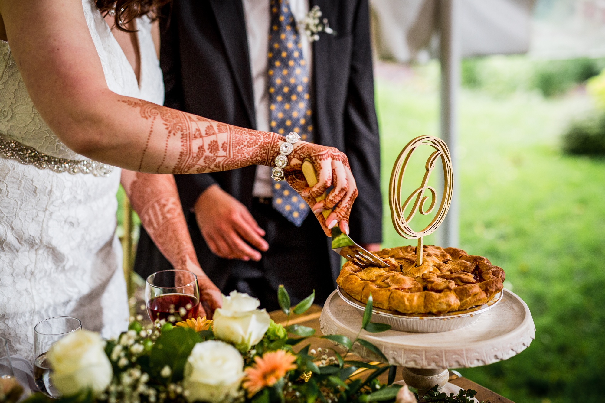 A couple cuts their cake at a backyard wedding in Yorkville, Illinois