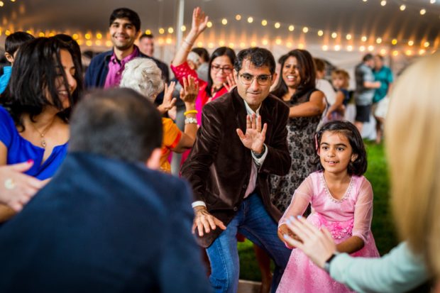 Guests dance together at a backyard wedding in Yorkville, Illinois