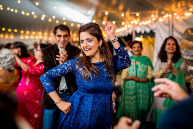 Guests dance together at a backyard wedding in Yorkville, Illinois