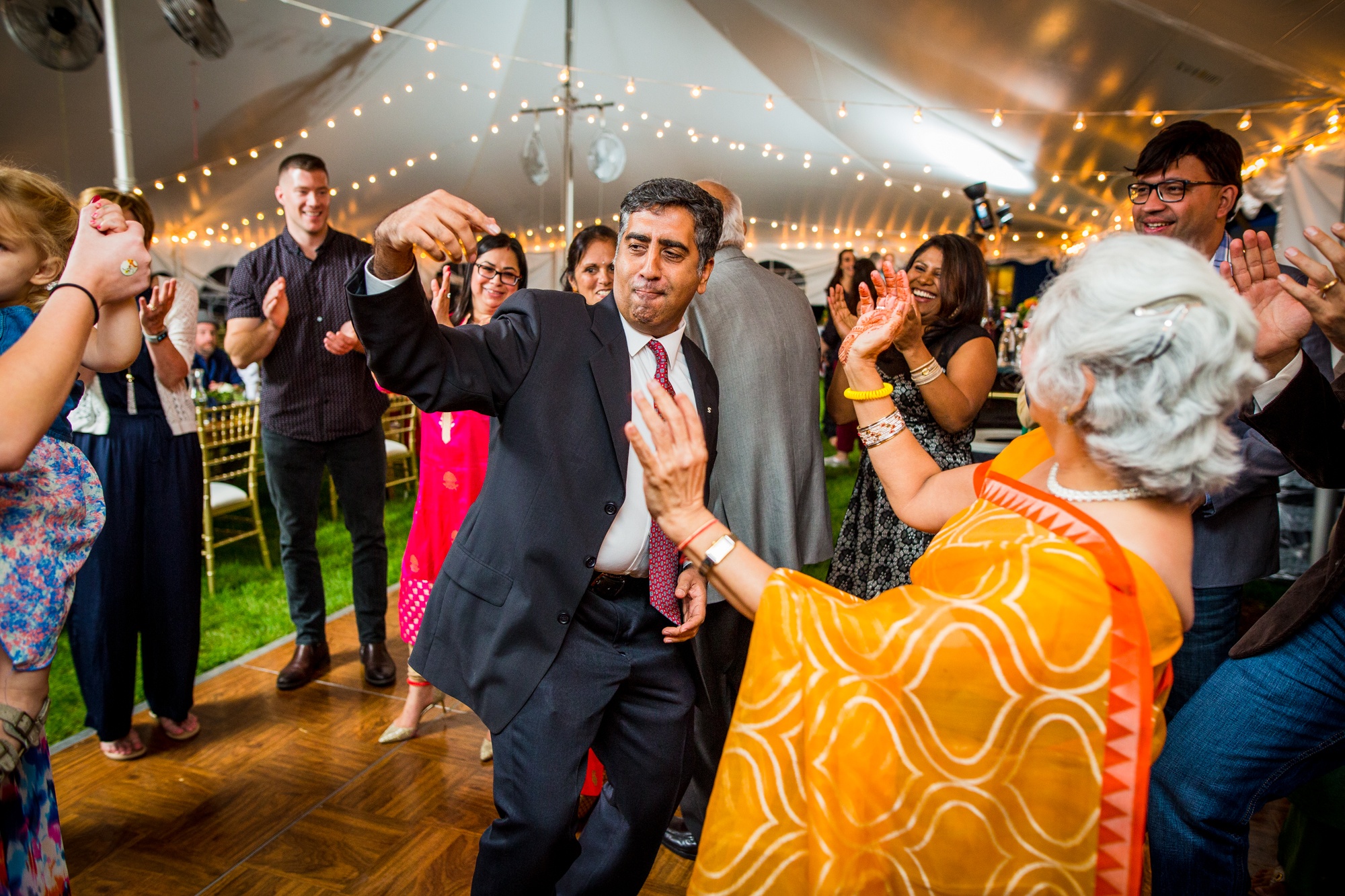 Guests dance together at a backyard wedding in Yorkville, Illinois