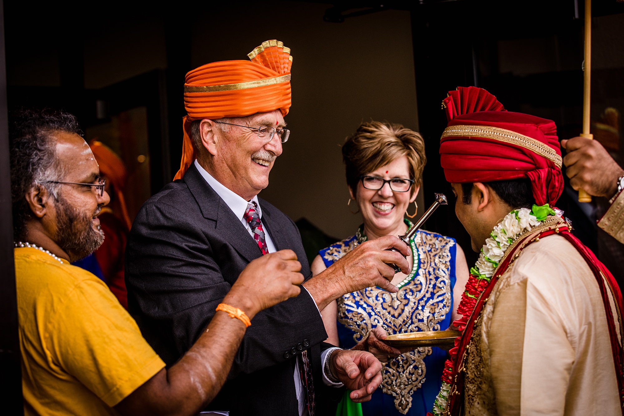 Parents offer gifts during an Aurora Balaji Temple wedding