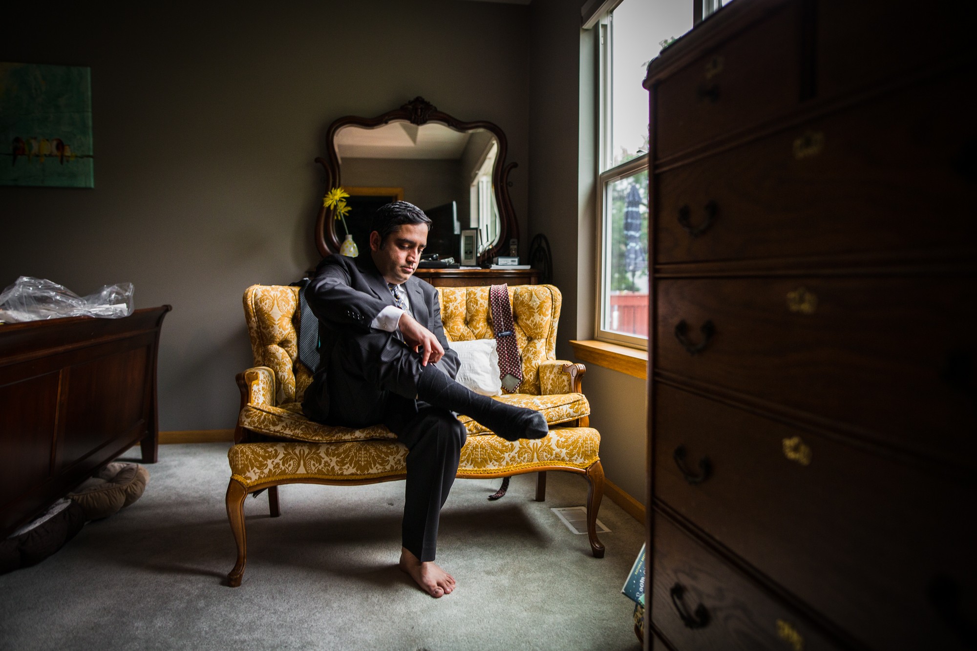 A groom gets ready before his backyard wedding in Yorkville, Illinois