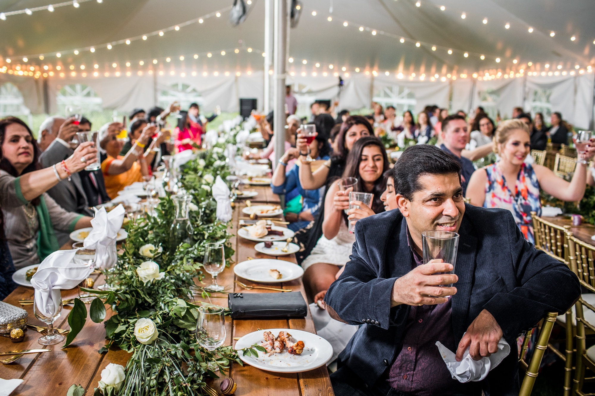 Guests share in a toast at a backyard wedding in Yorkville, Illinois