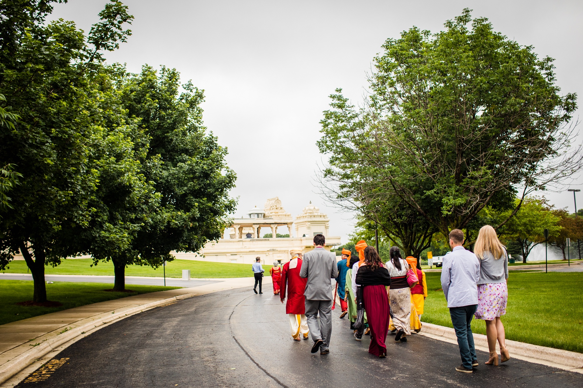 Guests walk to the baraat during an Aurora Balaji Temple wedding