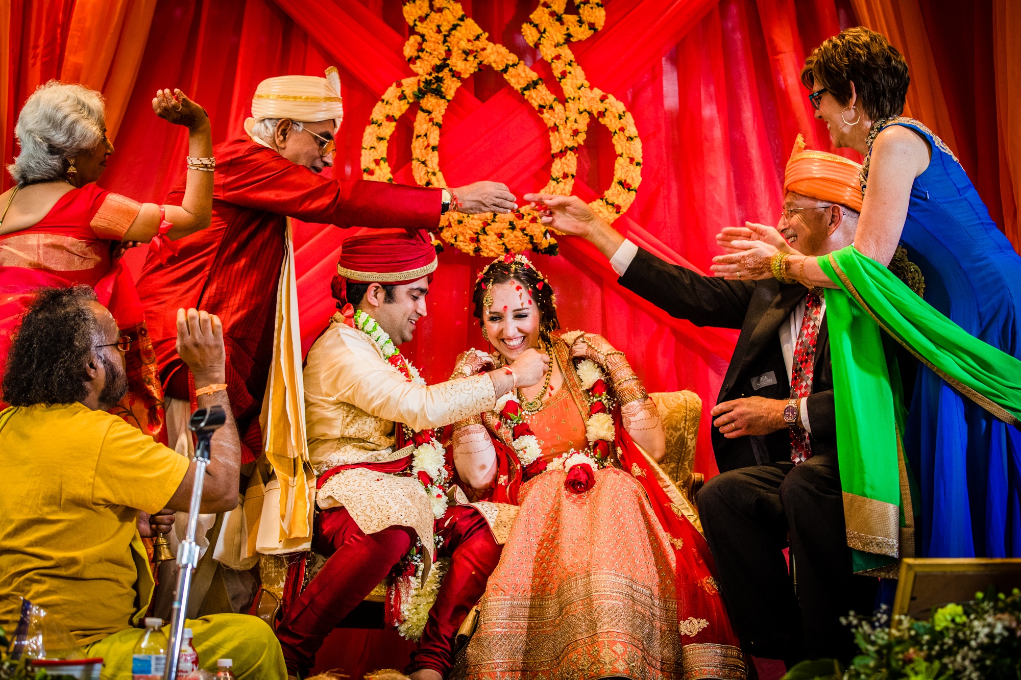 Parents throw rice at the newlyweds at an Aurora Balaji Temple wedding