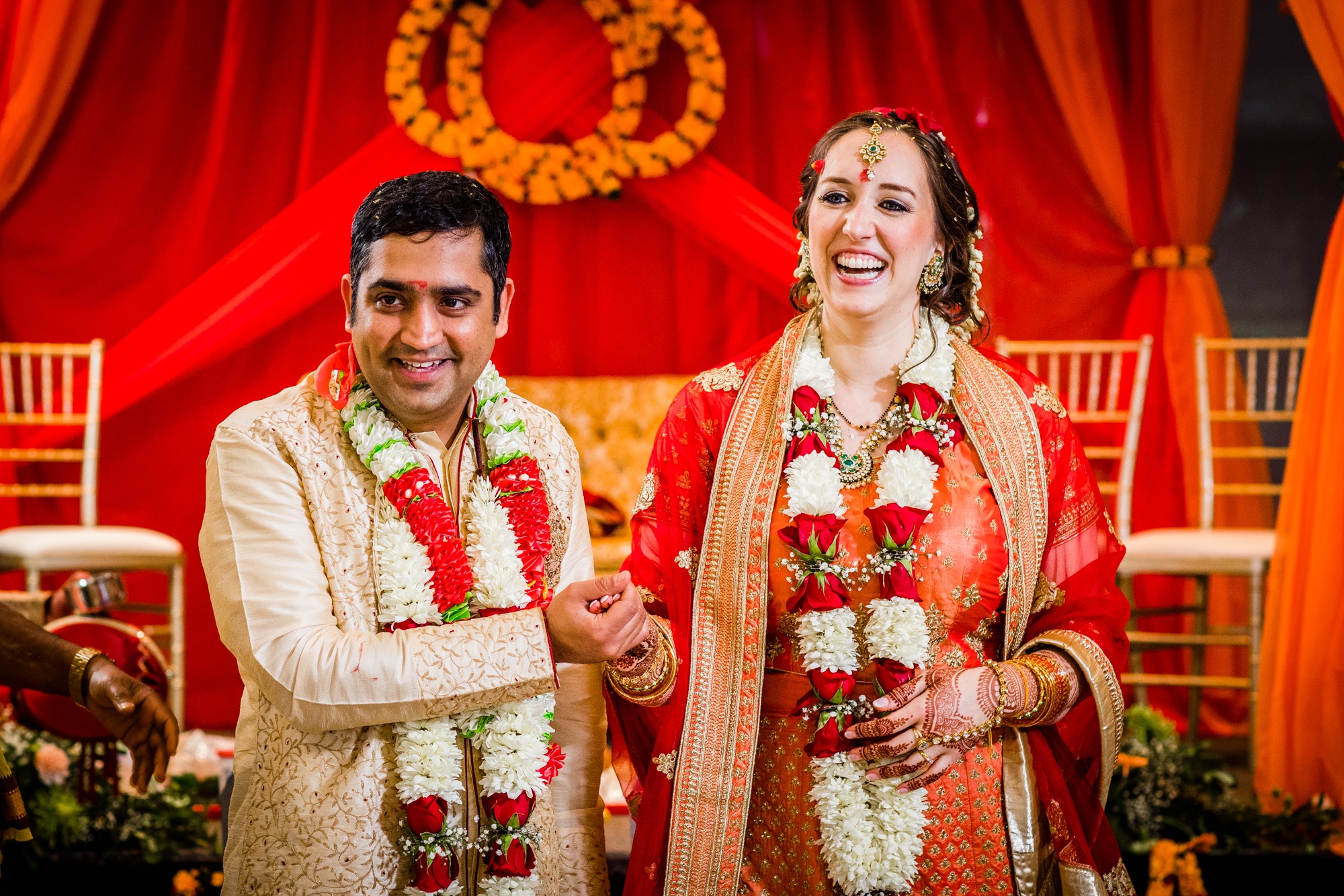 A couple laughs together during an Aurora Balaji Temple wedding