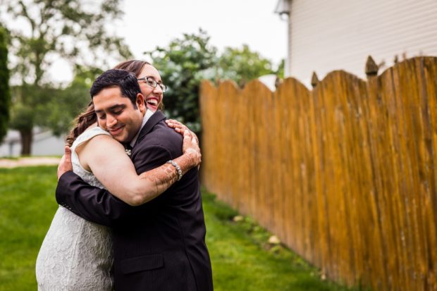 A couple hugs at a backyard wedding in Yorkville, Illinois