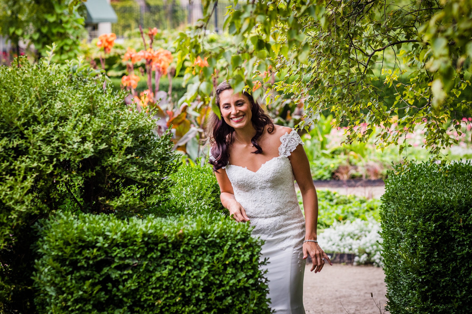 A bride walks to her first look with her groom at the Garfield Park Conservatory.