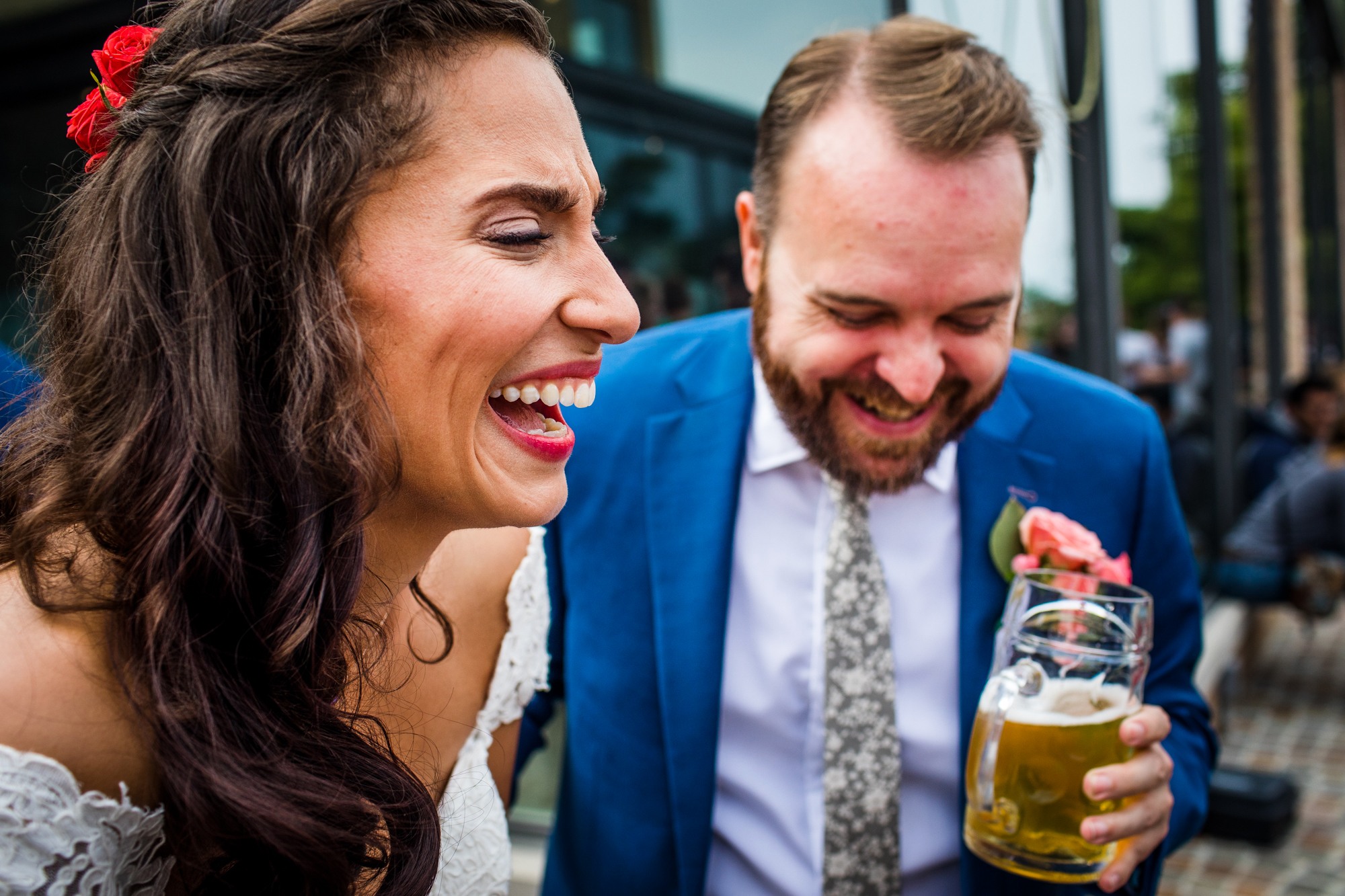 A couple laughs together at Metropolitan Brewing before their wedding