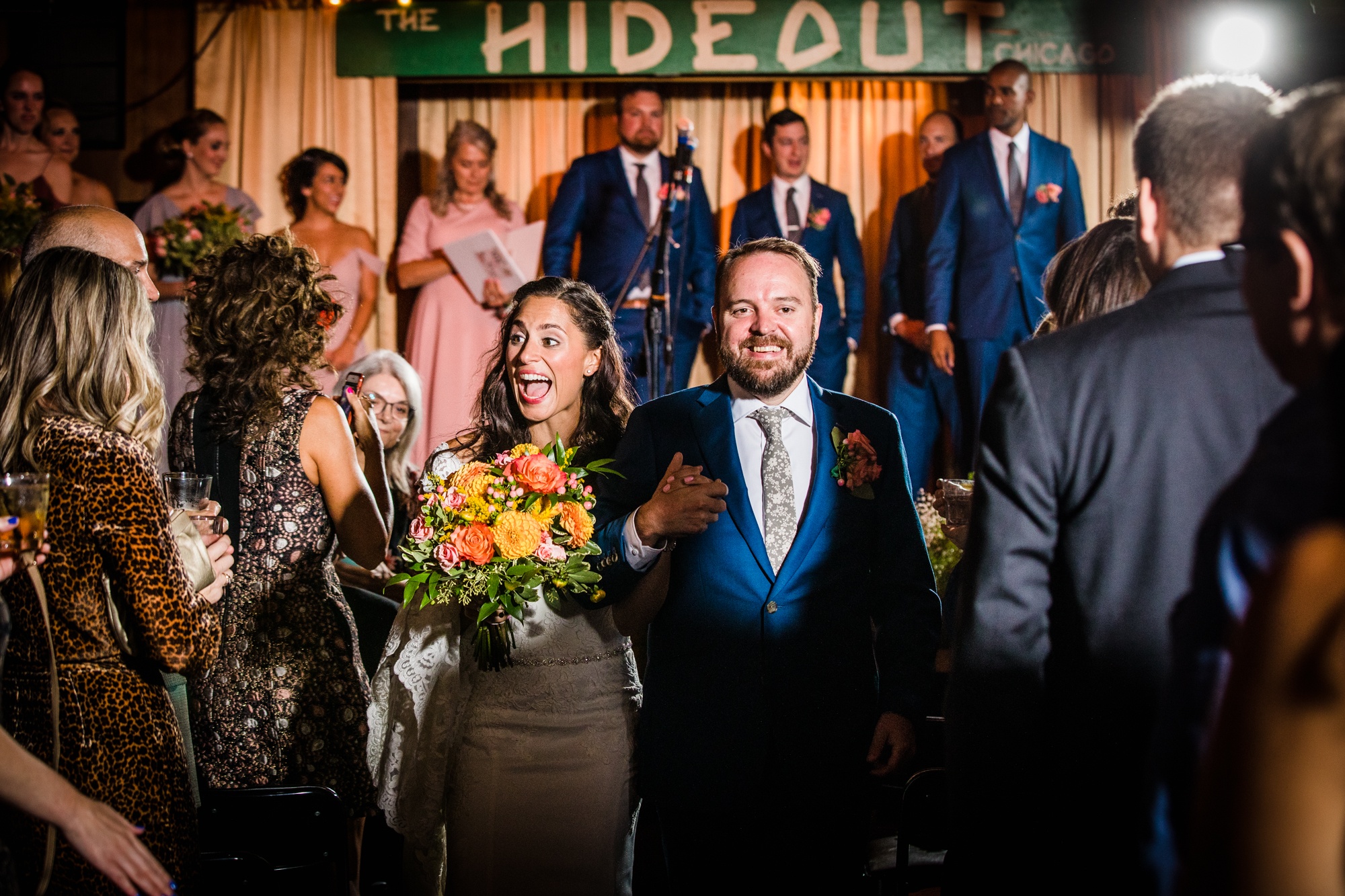 A couple celebrates at the end of their Hideout Chicago wedding ceremony