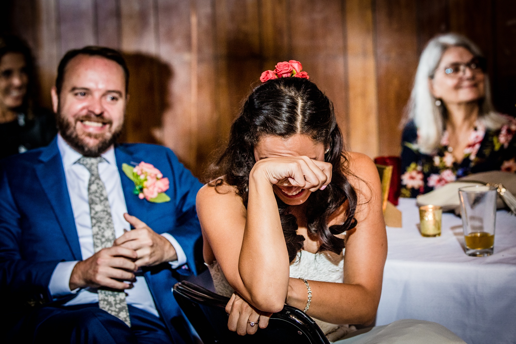 A bride laughs at a toast during a Hideout Chicago wedding reception