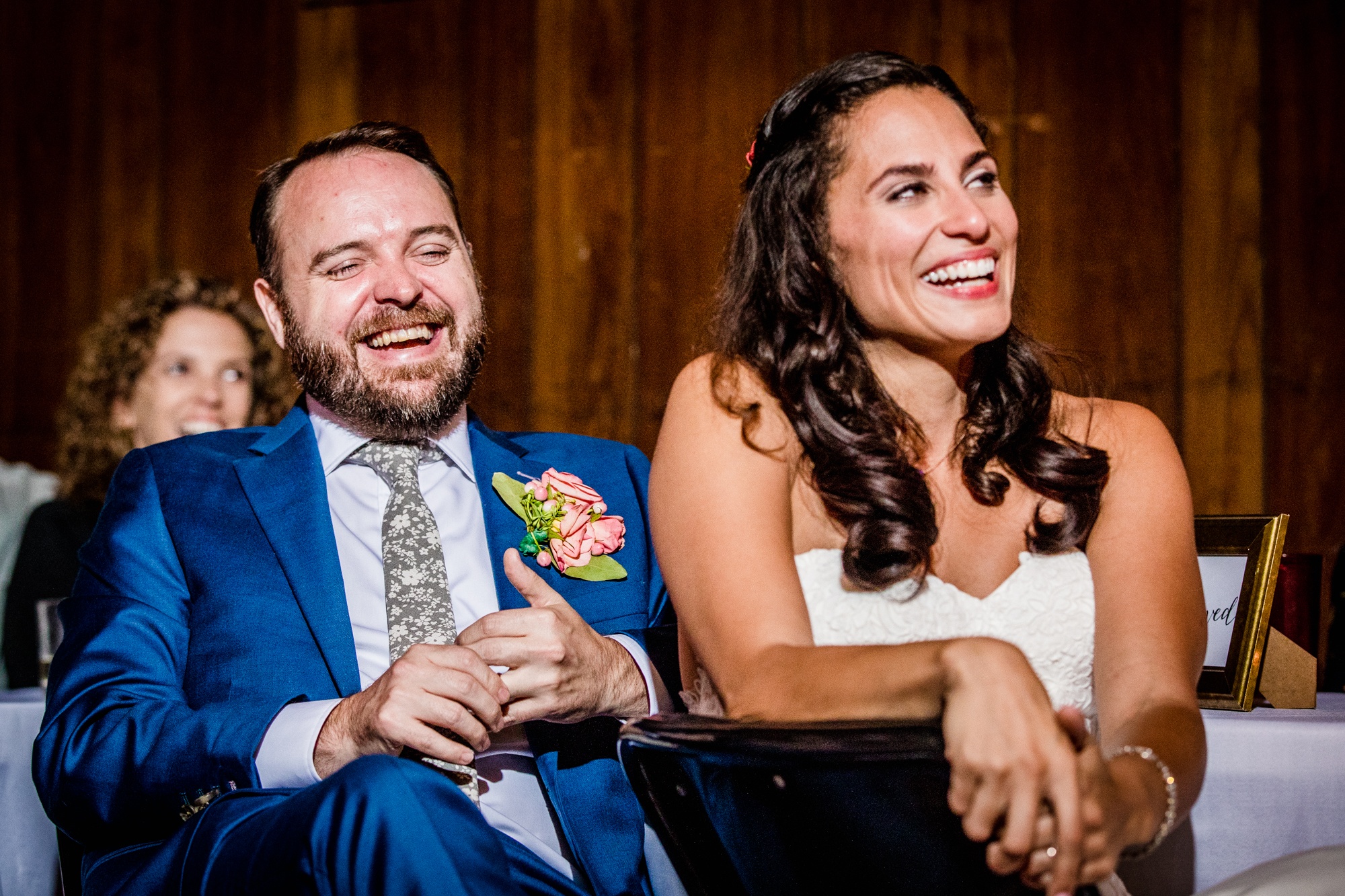 A couple laughs at a toast during a Hideout Chicago wedding reception
