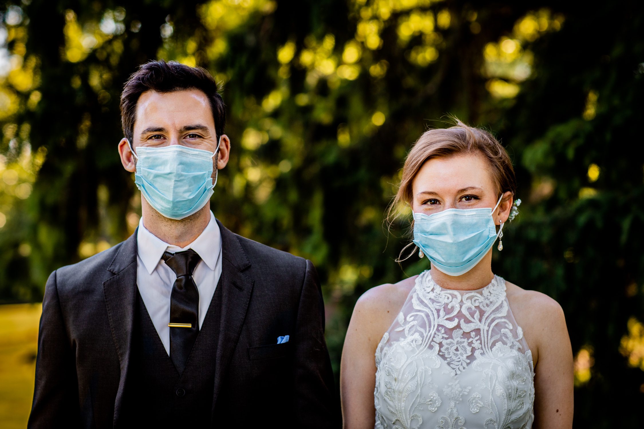 A bride and groom portrait in masks at a Naperville micro wedding at DuPage River Park.