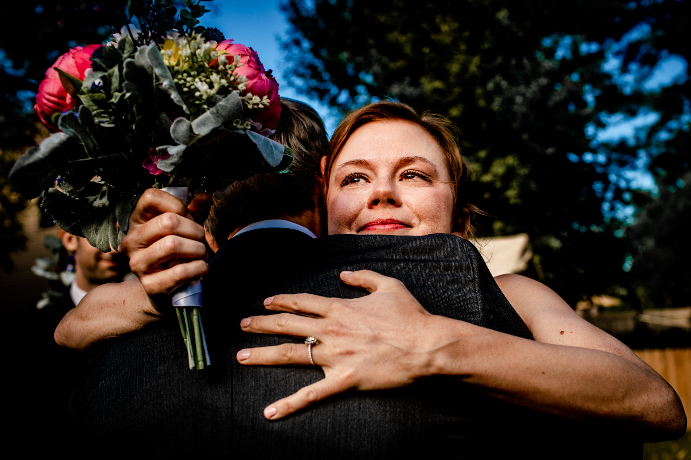 A bride hugs her dad at the end of the aisle during a micro wedding in Naperville.