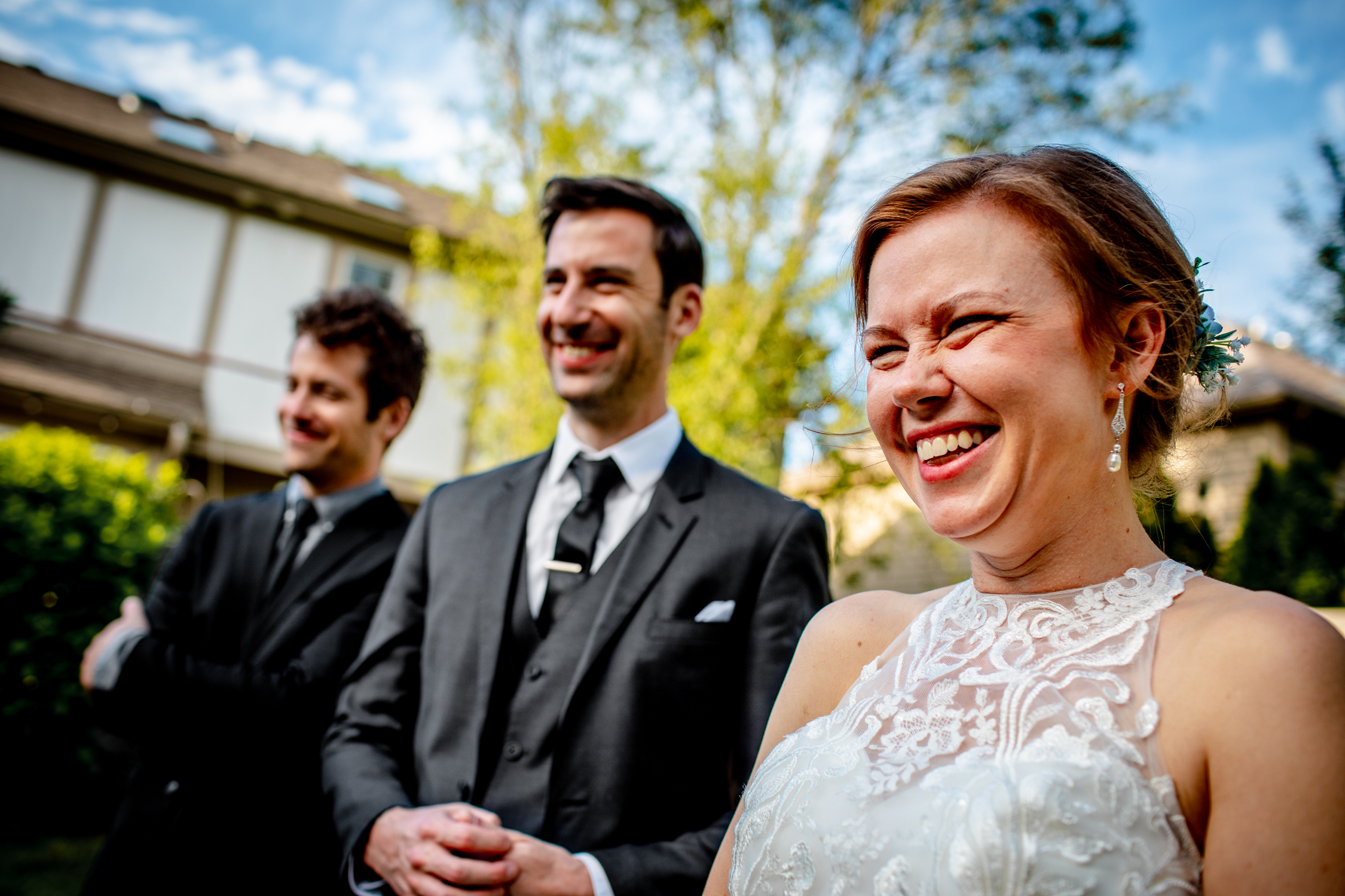 A bride and groom laugh during their Naperville micro wedding reception.