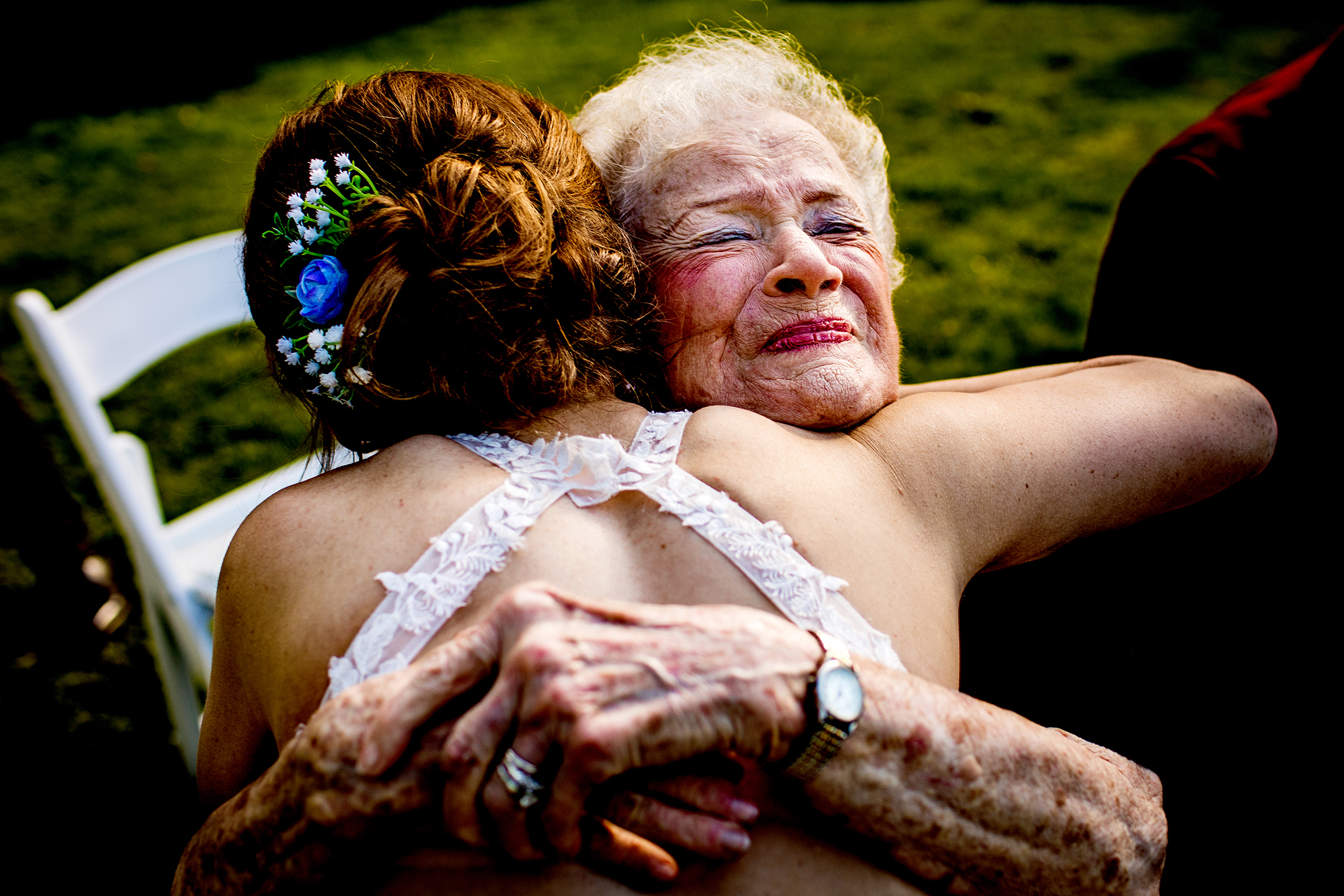 A grandmother hugs her granddaughter during a Naperville micro wedding.