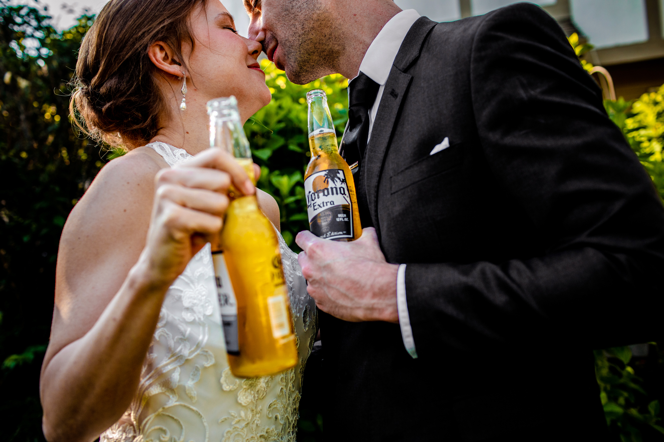 A bride and groom drink Coronas together during a Naperville micro wedding reception.