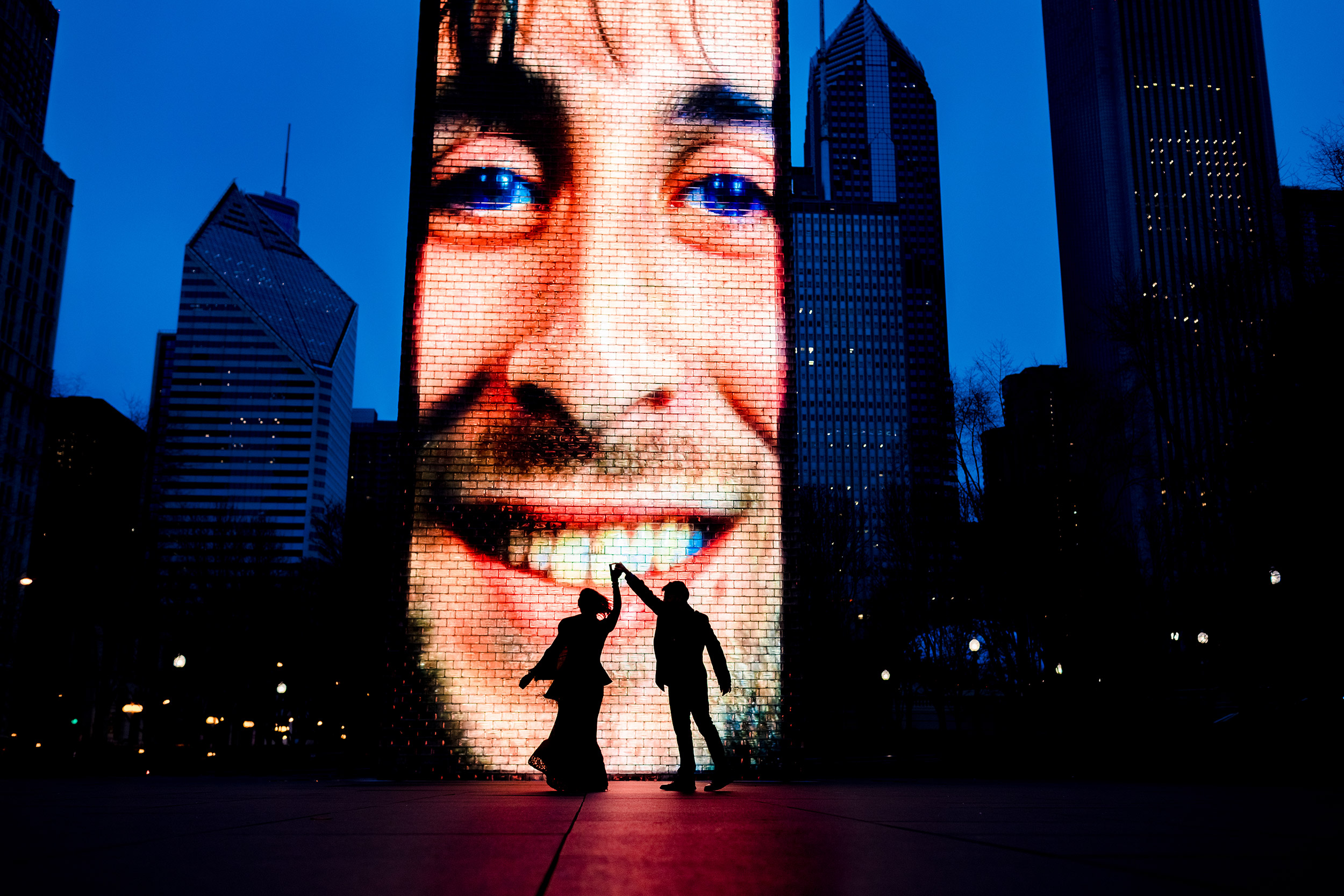 A couple dances together in an empty Millennium Park during an elopement in downtown Chicago.