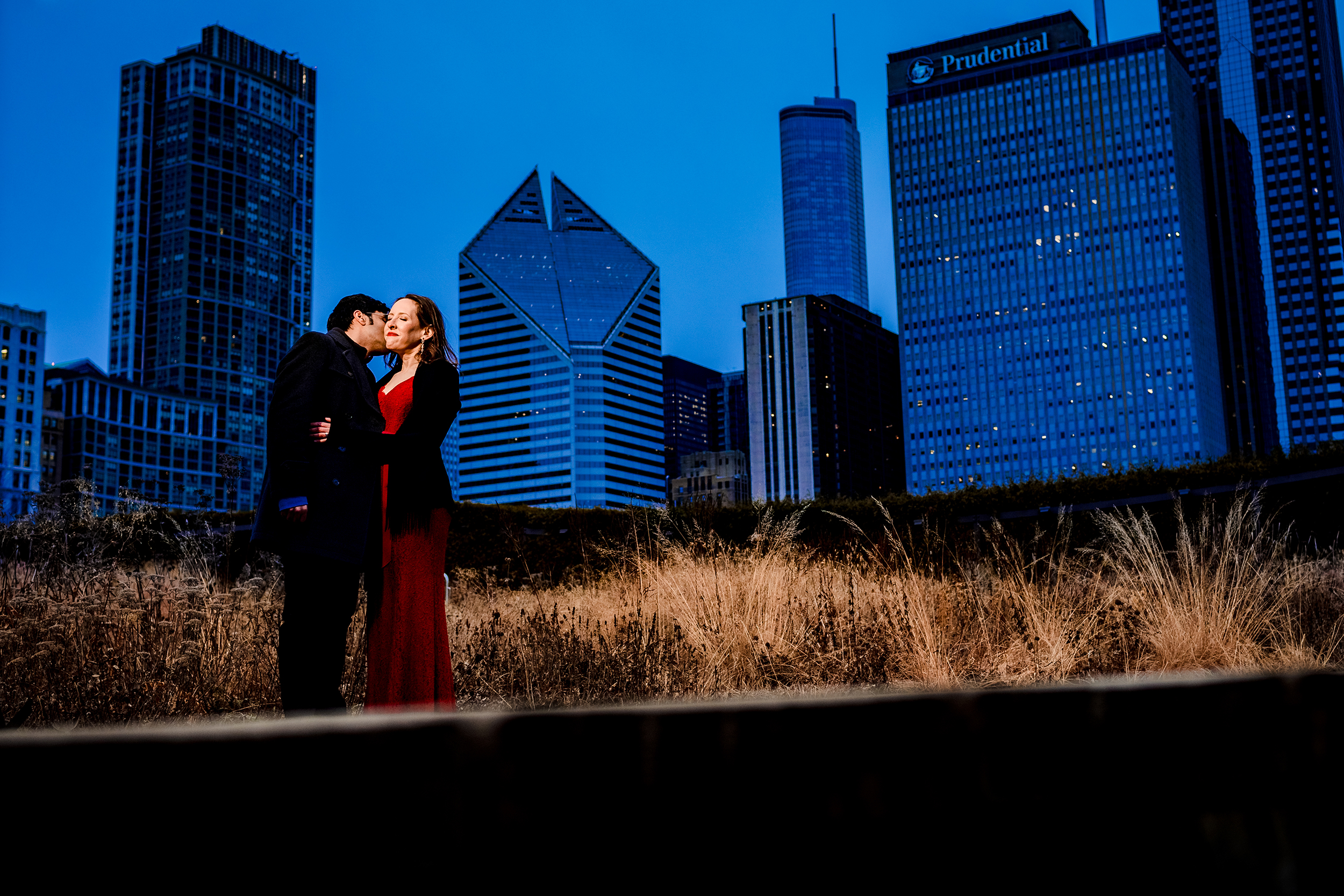 A couple hugs each other at sunset in Lurie Gardens during an elopement in downtown Chicago.