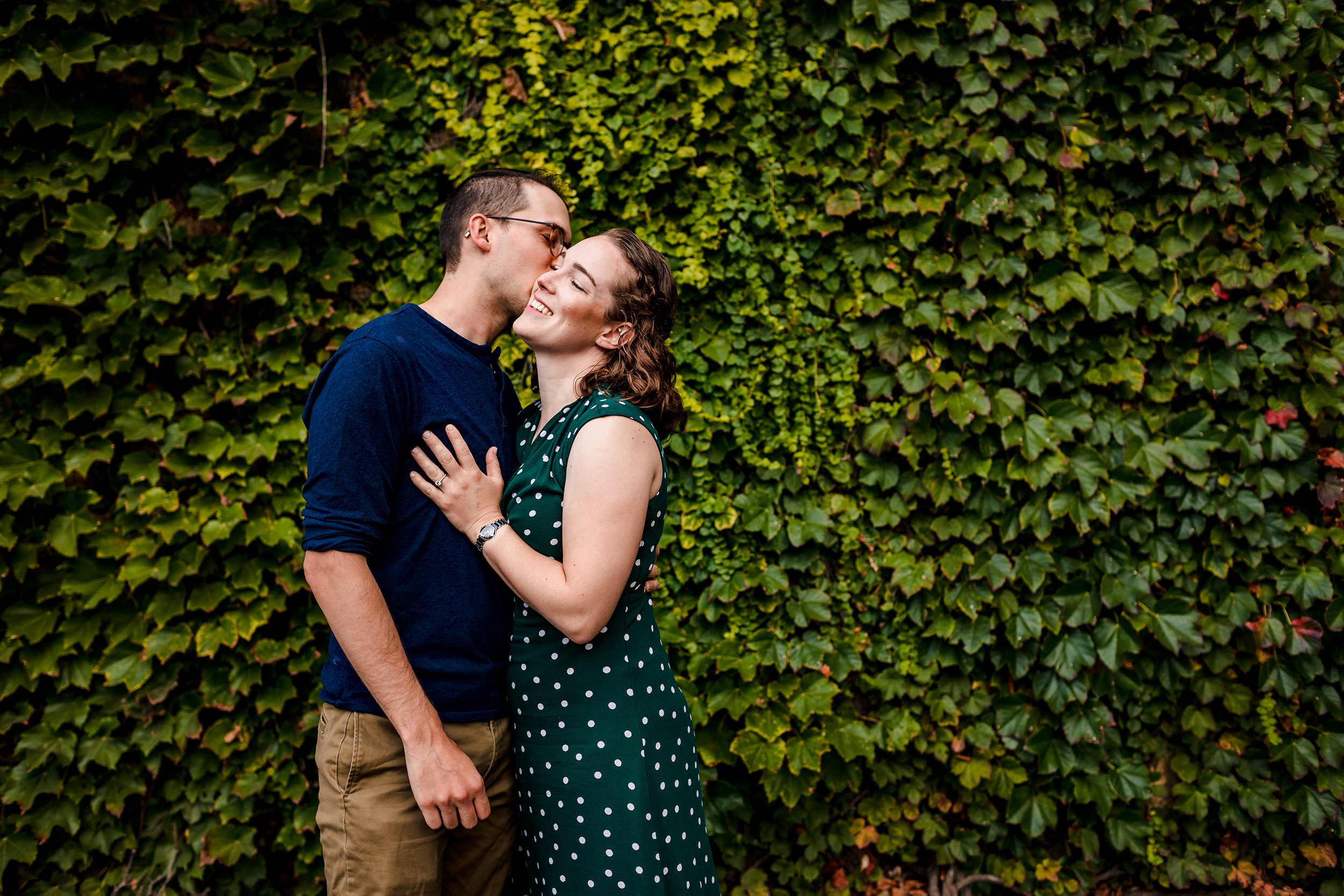 A couple laughs together during a West Loop engagement session.