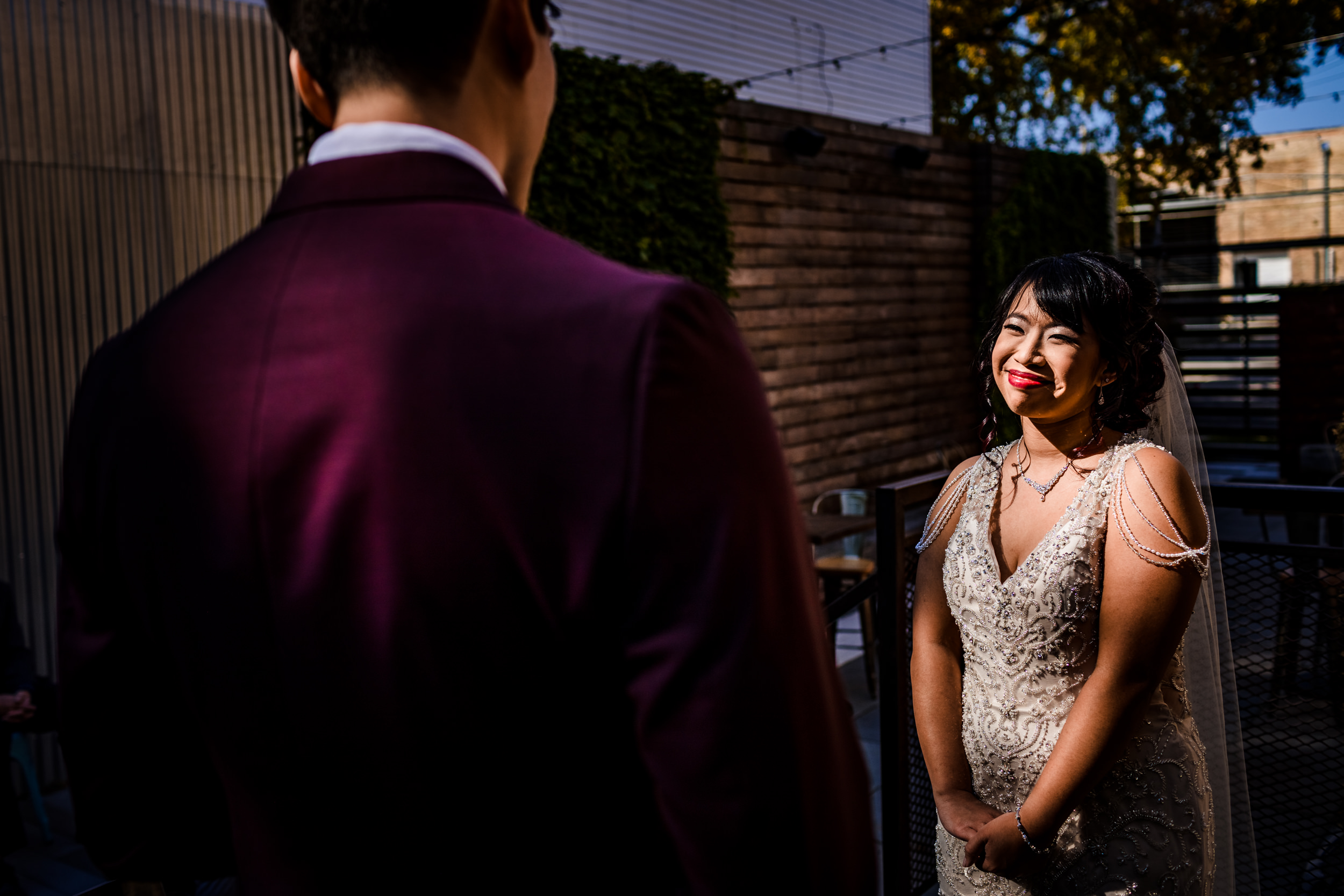 A bride smiles during her ceremony at a wedding at The Joinery in Chicago.