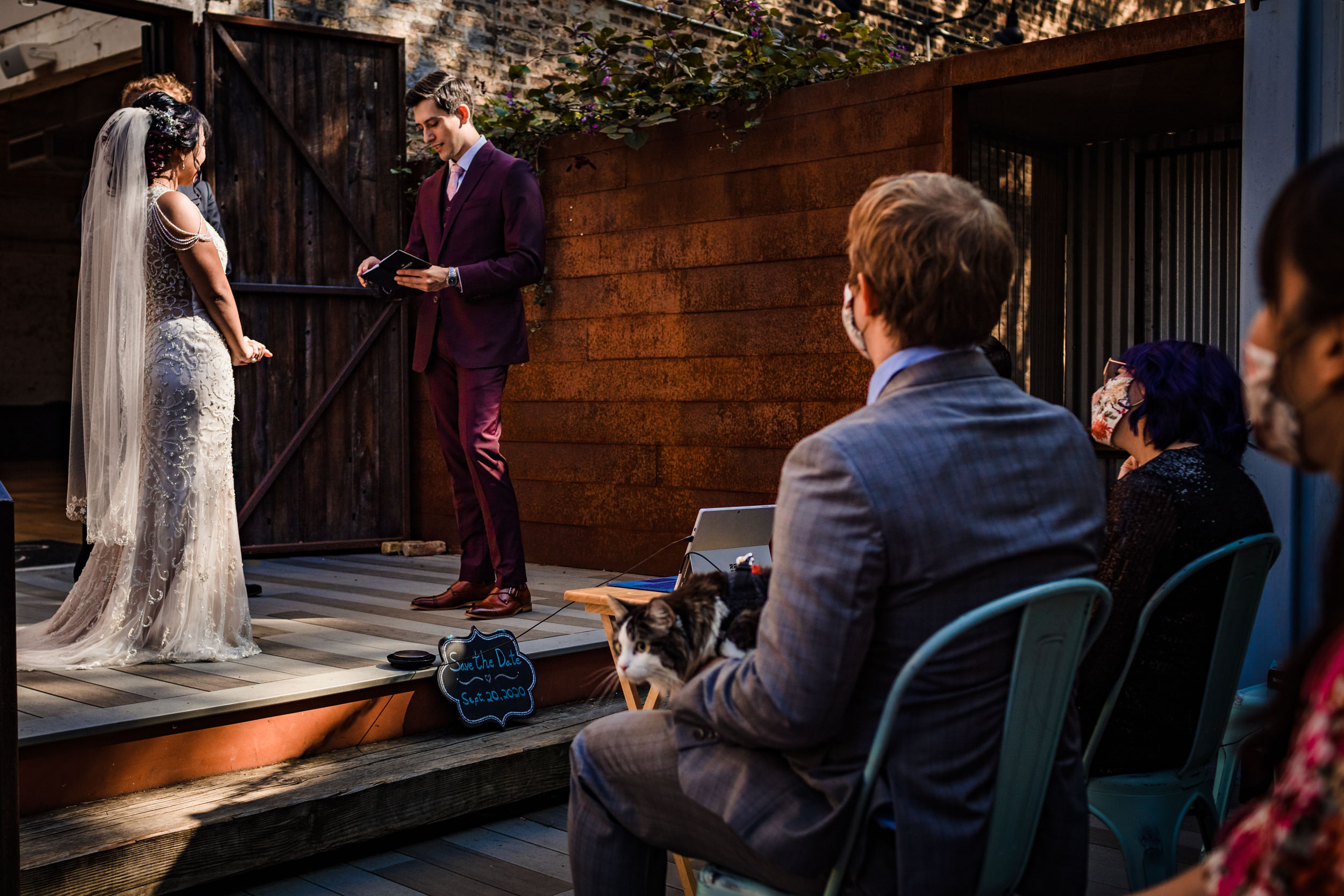 Guests watch a ceremony during a wedding at the Joinery.