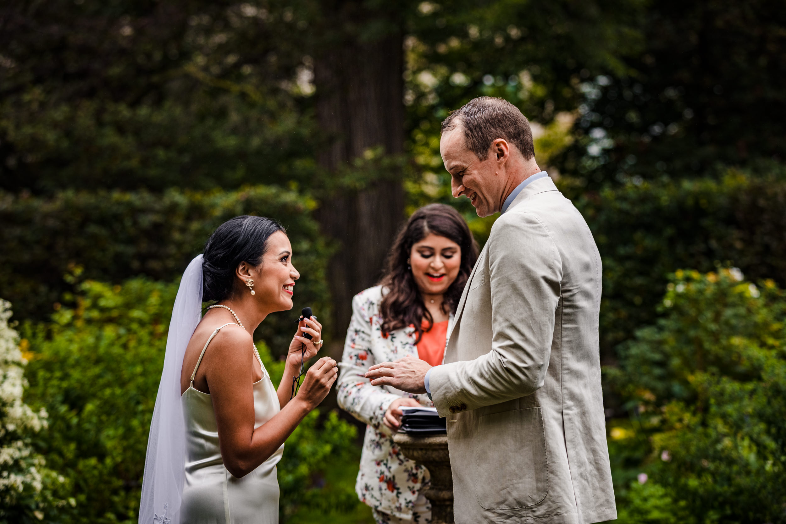 A couple shares their vows during a Shakespeare Garden micro wedding in Evanston.