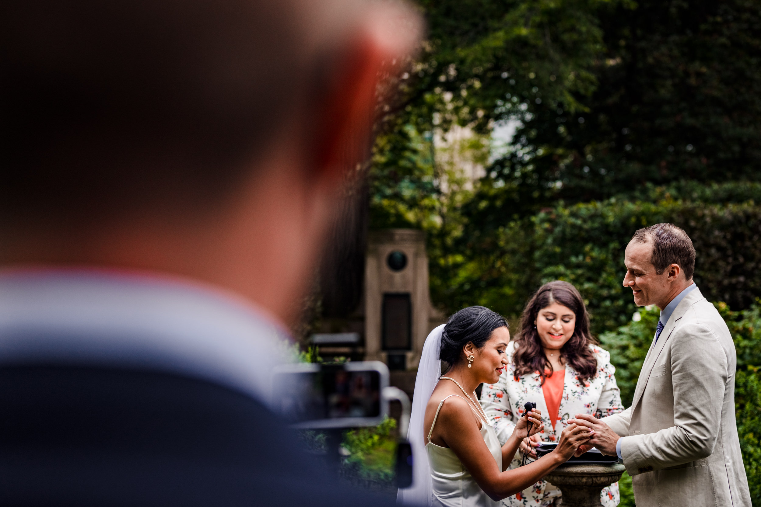 A couple shares their vows during a Shakespeare Garden micro wedding in Evanston.