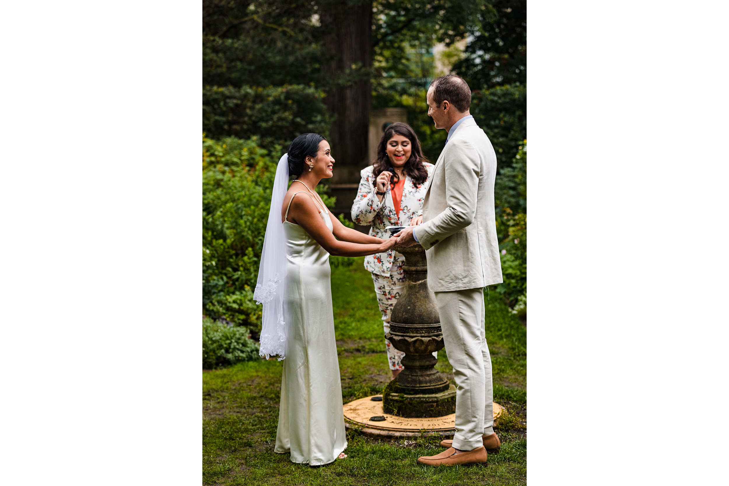 A couple laughs during their vows at a Shakespeare Garden micro wedding in Evanston.