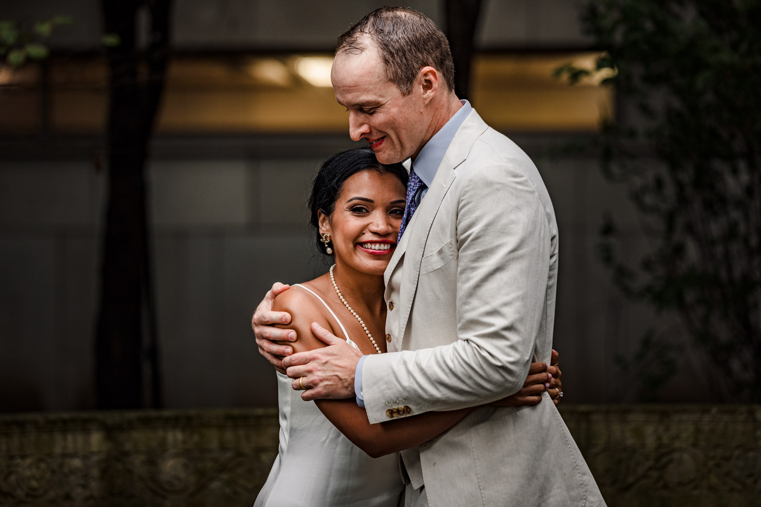 A couple shares their first dance together during a Shakespeare Garden micro wedding in Evanston.
