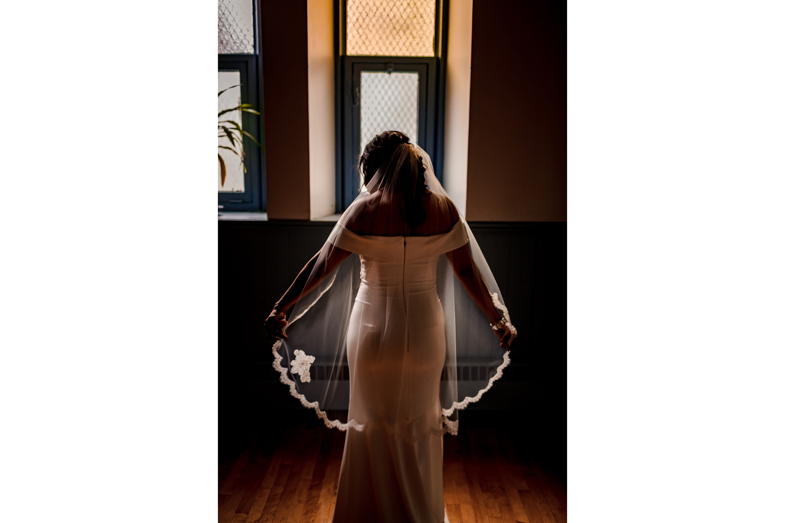 A bride adjusts her veil before her Church of the Ascension garden wedding in downtown Chicago.