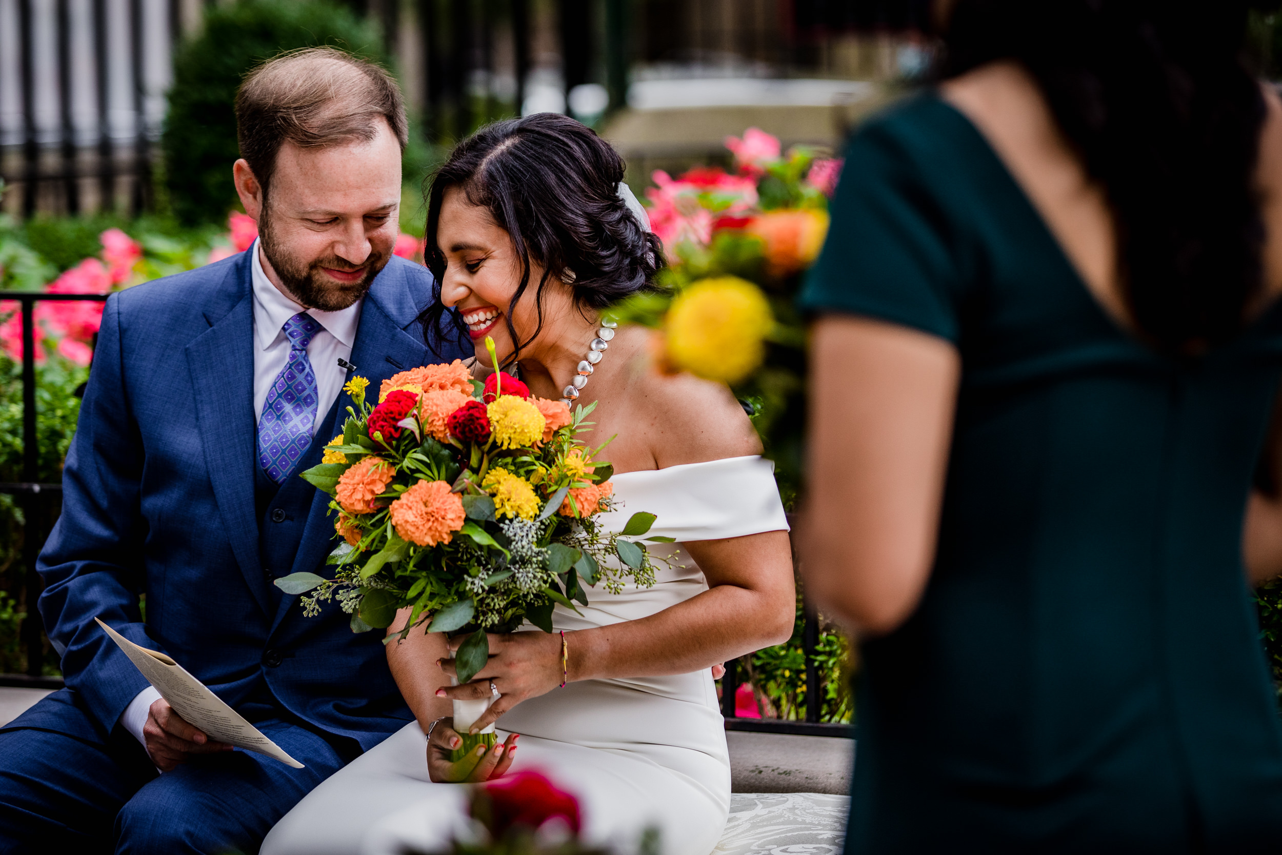A couple laughs together during a Church of the Ascension garden wedding in downtown Chicago.