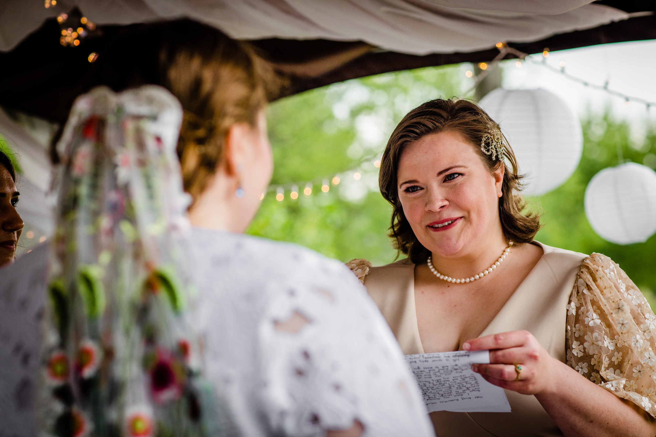 A bride shares her vows during a backyard wedding in New Lenox, Illinois.