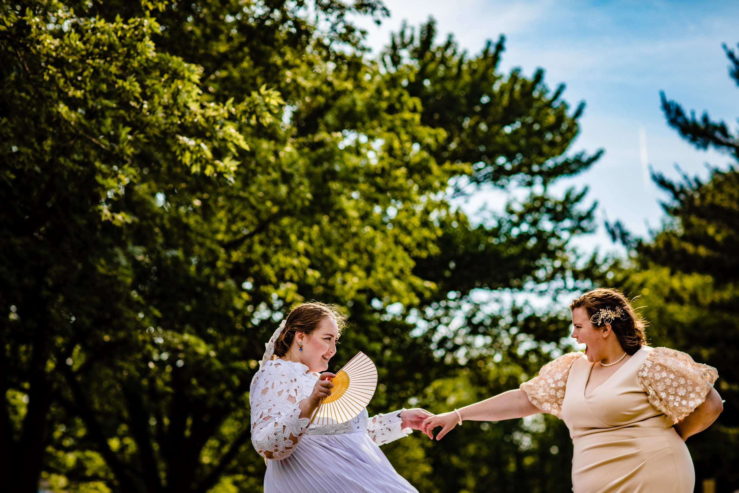 Brides dance together during a portrait session at a backyard wedding in New Lenox, Illinois.
