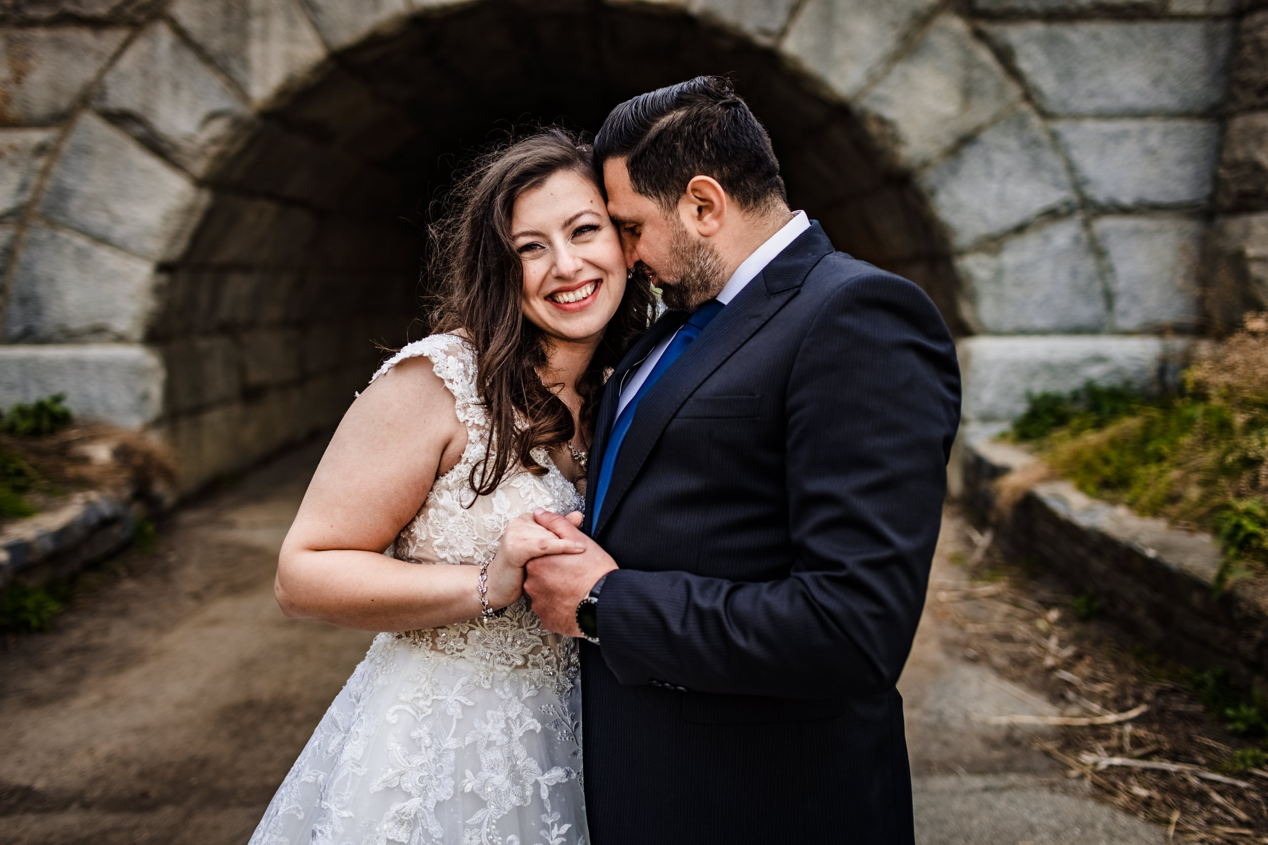 A couple hugs near the Lincoln Park underpass during a Spring elopement in Chicago.