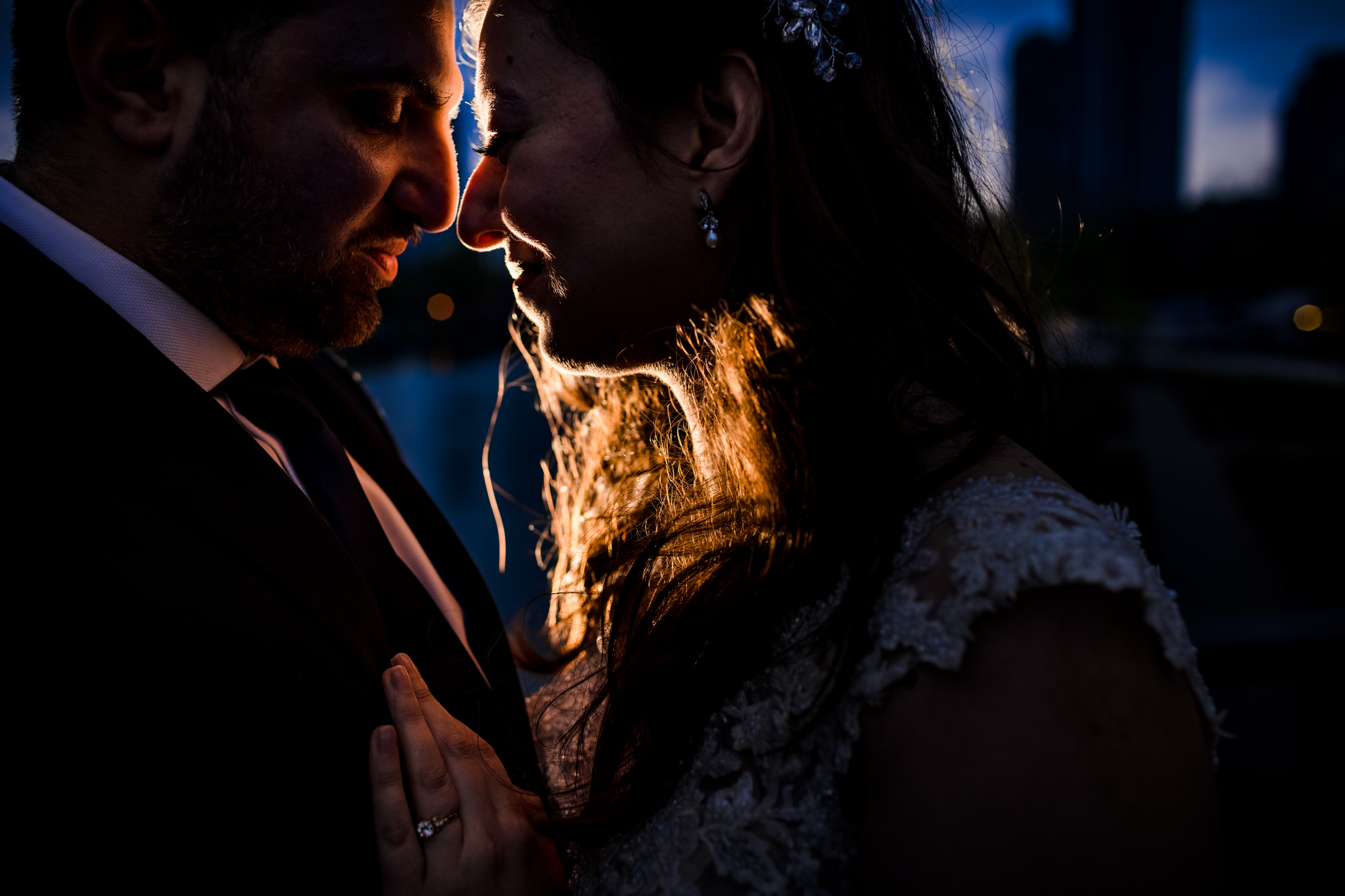 A couple holds each other at sunset during a Lincoln Park elopement in Chicago.